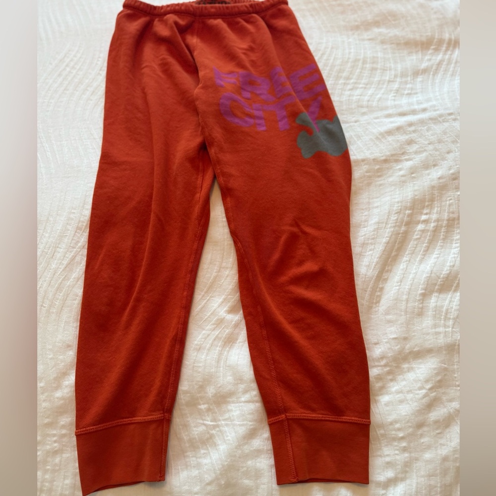 Freecity women’s sweat Joggers in Burnt Orange with Gray Logo
